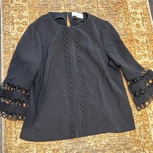 Black 3/4 sleeve length top from Pearl by Lela Rose. Embroidery & pearl details